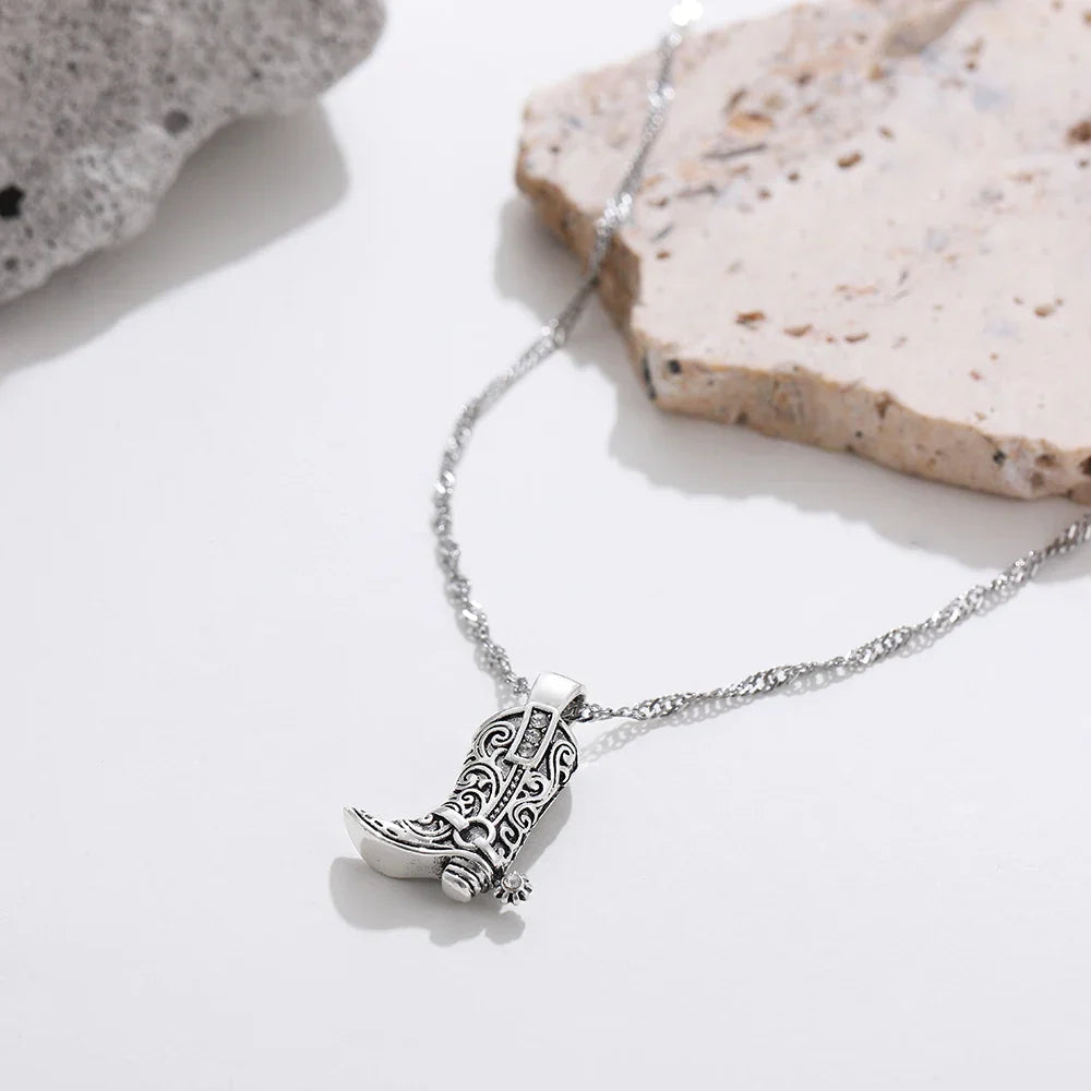 Gold-plated Western rodeo cowboy pendant necklace with intricate engraving and sparkling rhinestones