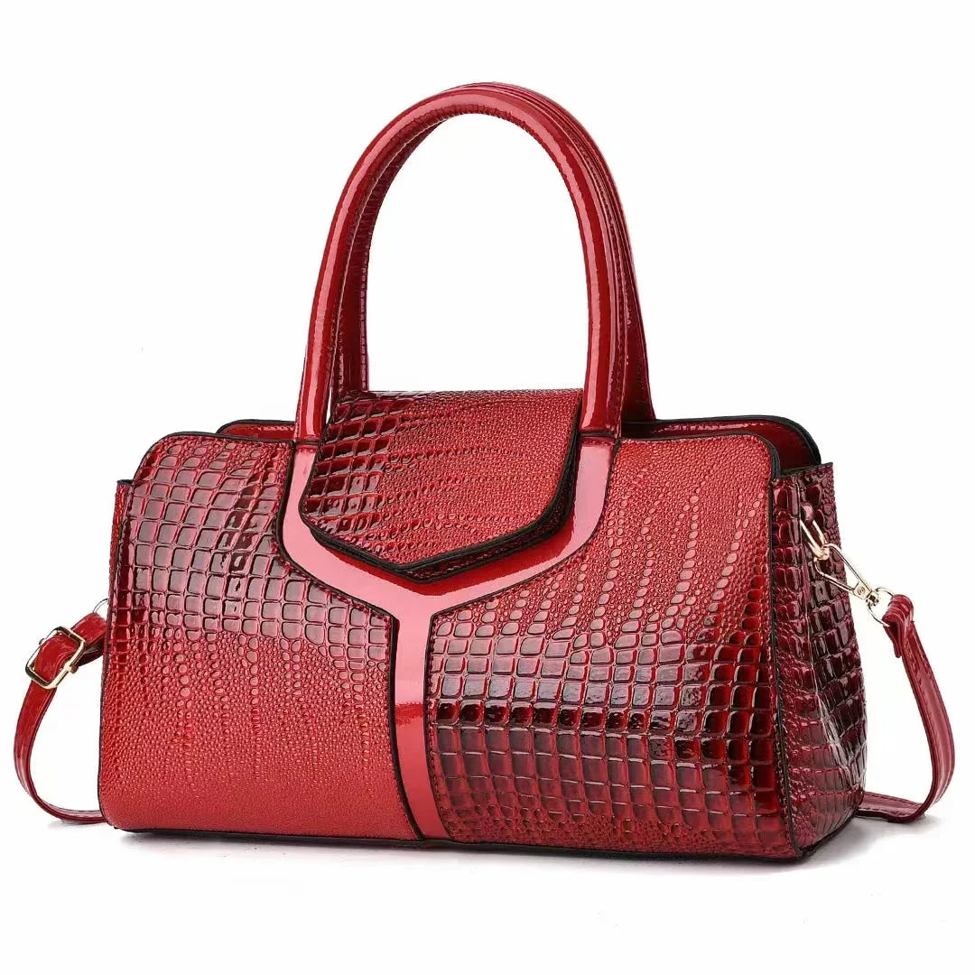 Women's structured brown embossed leather satchel bag with polished silhouette for everyday use