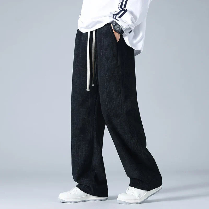 Azure blue corduroy sweatpants relaxed fit with drawstring waist, thick textured retro finish
