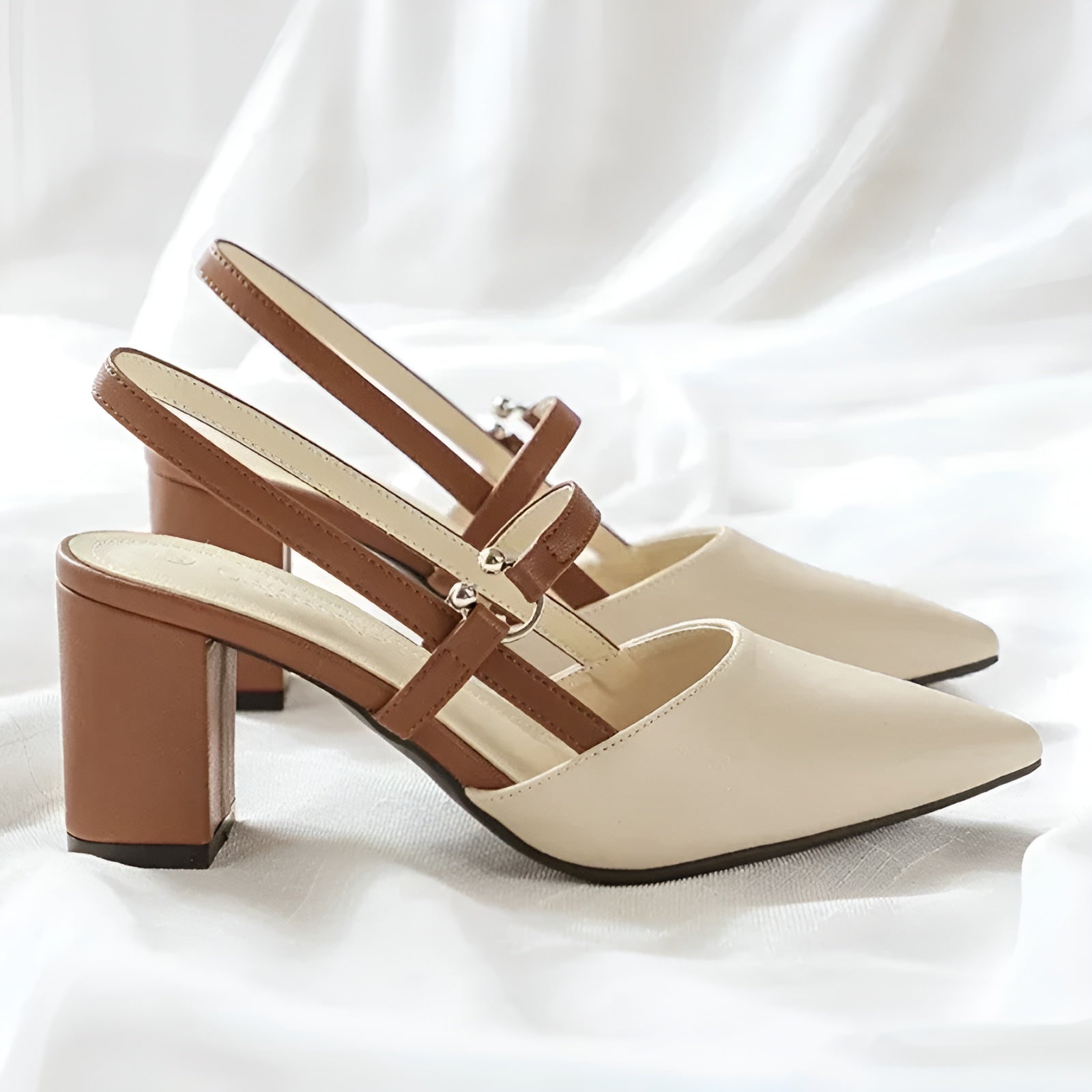Women's color-block slingback heels with pointed toe, bold contrast panels, day-to-night style