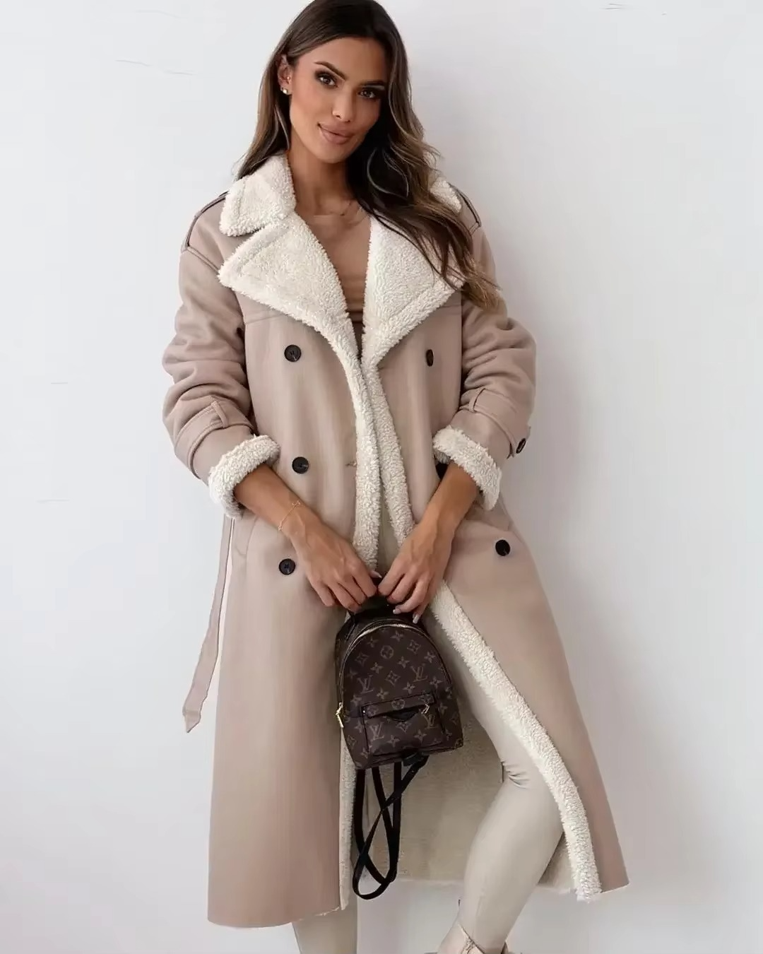 Women's black PU leather double-breasted trench coat with stand collar and plush interior lining
