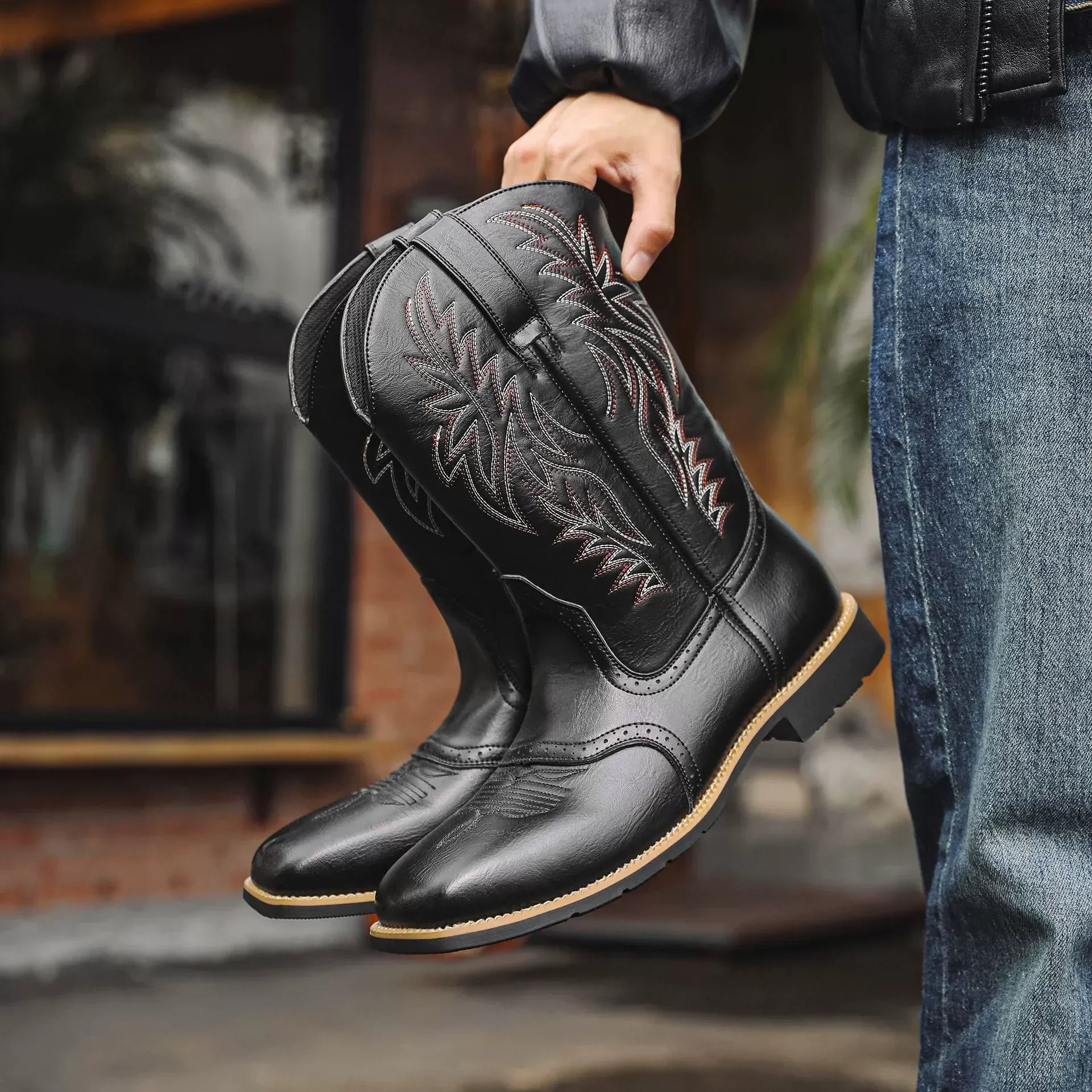 Men's brown leather Western cowboy boots with pointed toe and decorative stitched detailing