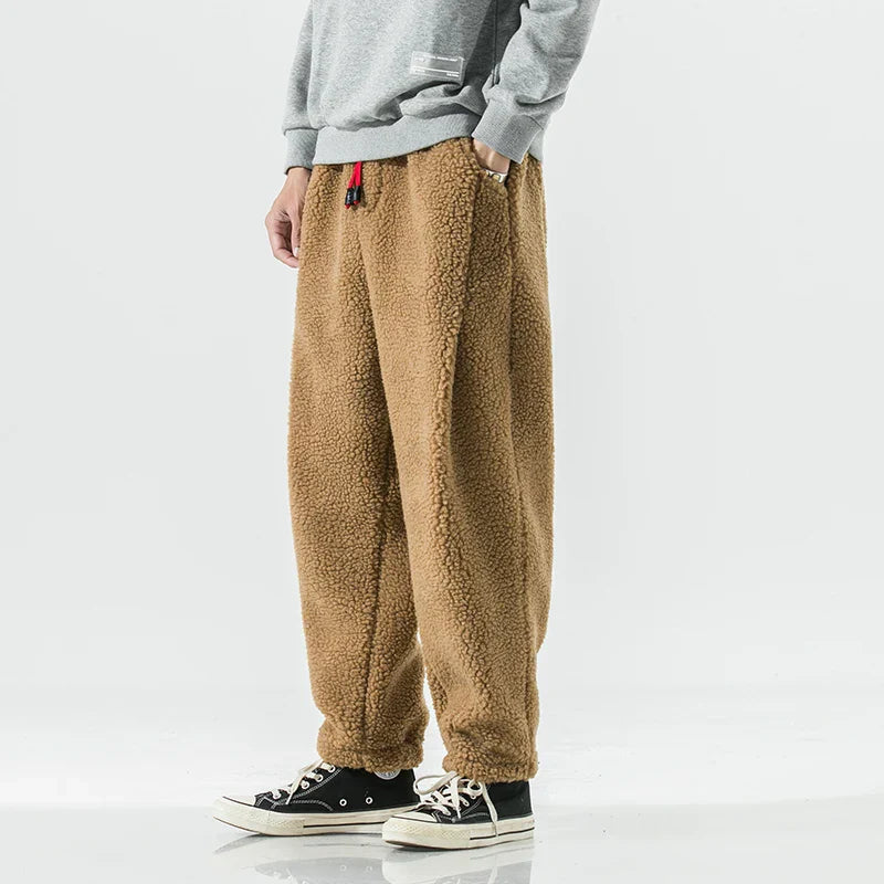 Men's slim tapered jogger pants with elastic waistband and side pockets for cool-weather comfort