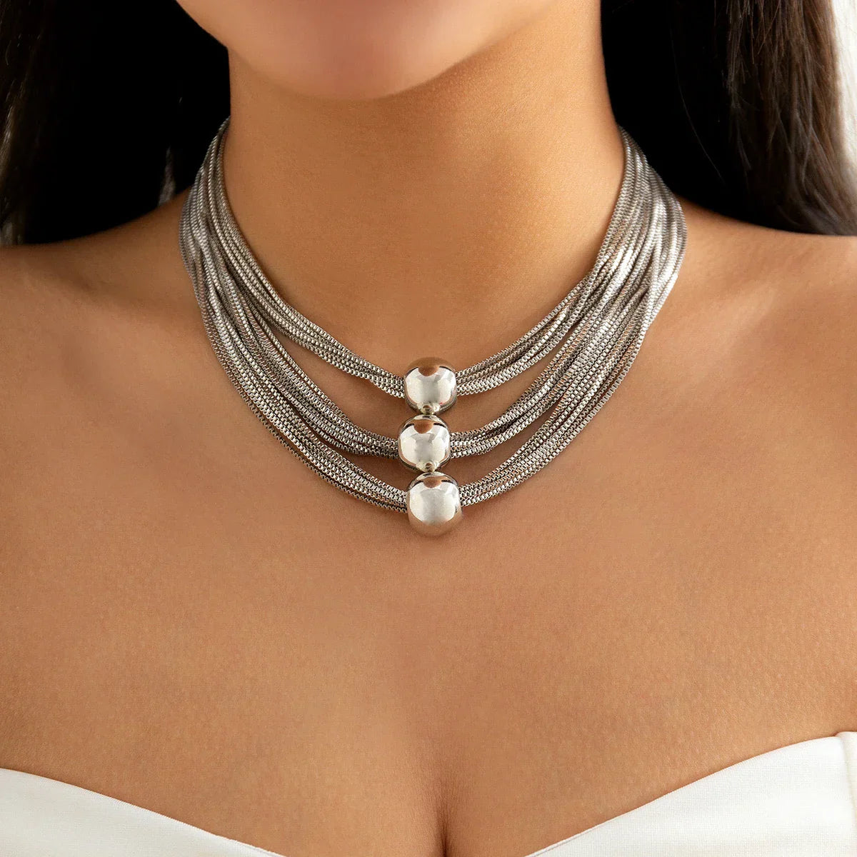Gold three-tier layered ball drape necklace vintage-inspired delicate cascading chains elegant silhouette