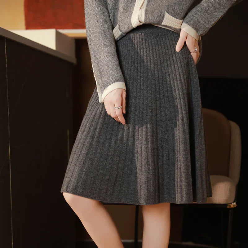 Women's brushed wool ribbed knit skirt with subtle pleated flare, soft cozy warm silhouette
