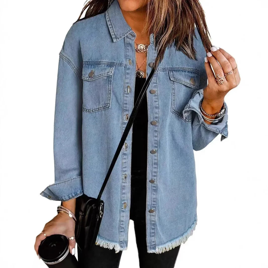 Women's relaxed fit washed denim shirt jacket with button-down front, chest pockets, and fringe hem