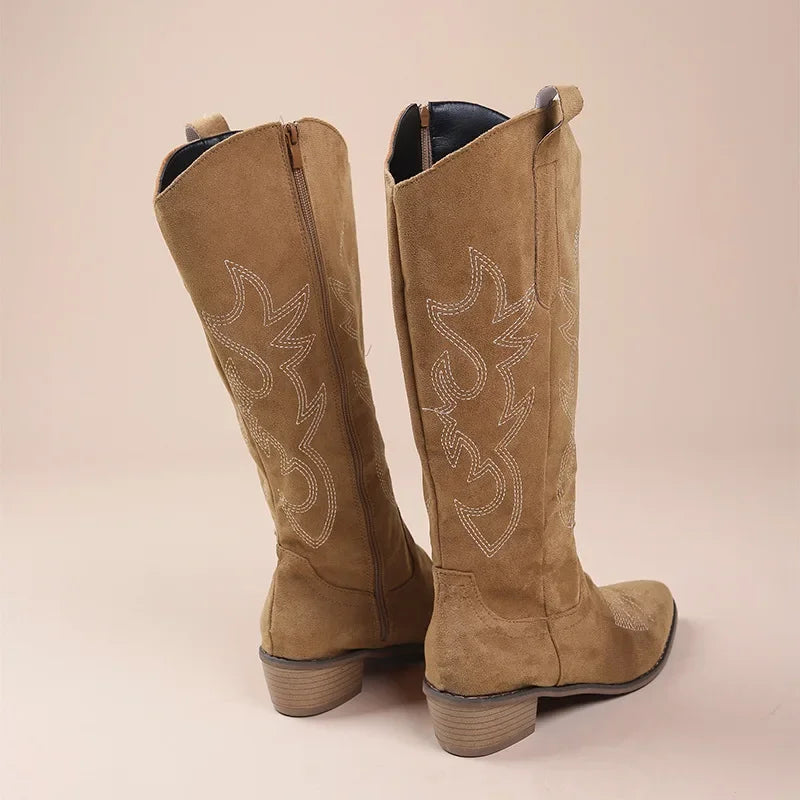 Women's mid-calf cowboy boots in suede texture with intricate white embroidered shaft, low heel western style