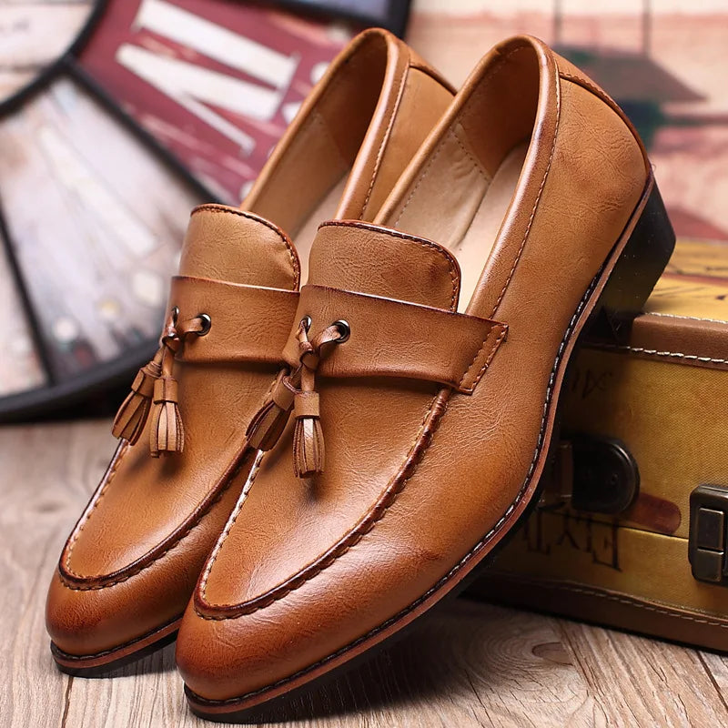 Brown leather moccasin loafers with stitched toe detail, polished slip-on style for professionals