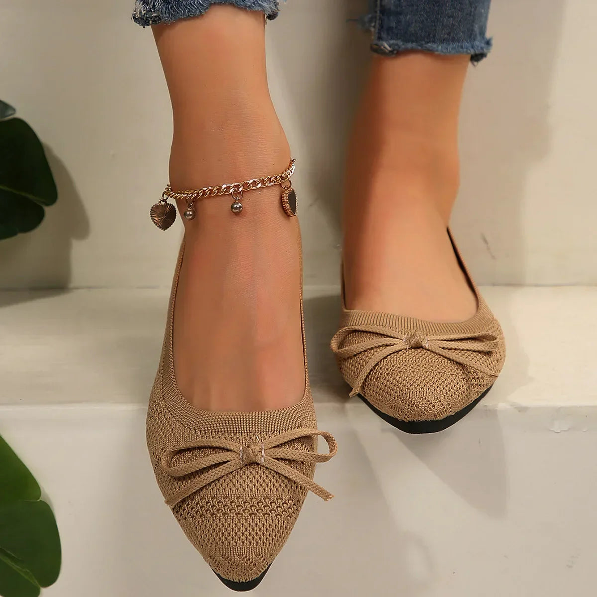 Women's knit flats with tassel bow detail, lightweight breathable mesh upper, casual feminine style