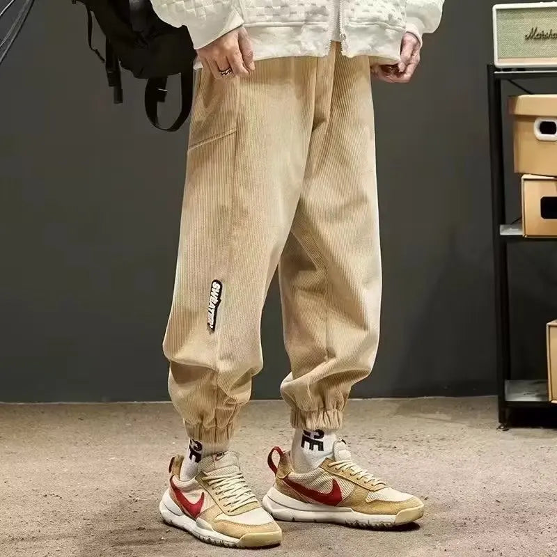 Men's corduroy joggers tailored fit with elastic cuffs dressed-up streetwear style subtle texture