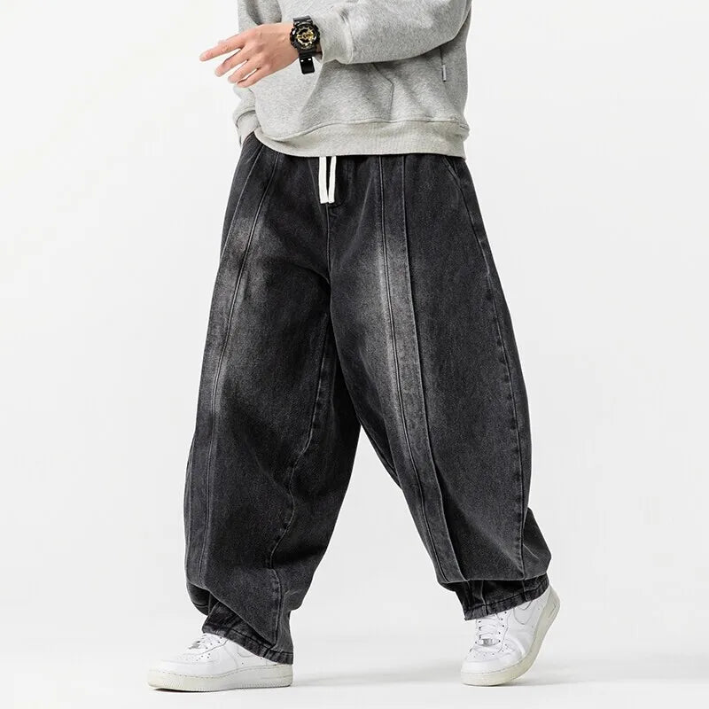 Japanese oversized baggy jeans pleated front drawstring waist dramatic 90s streetwear silhouette
