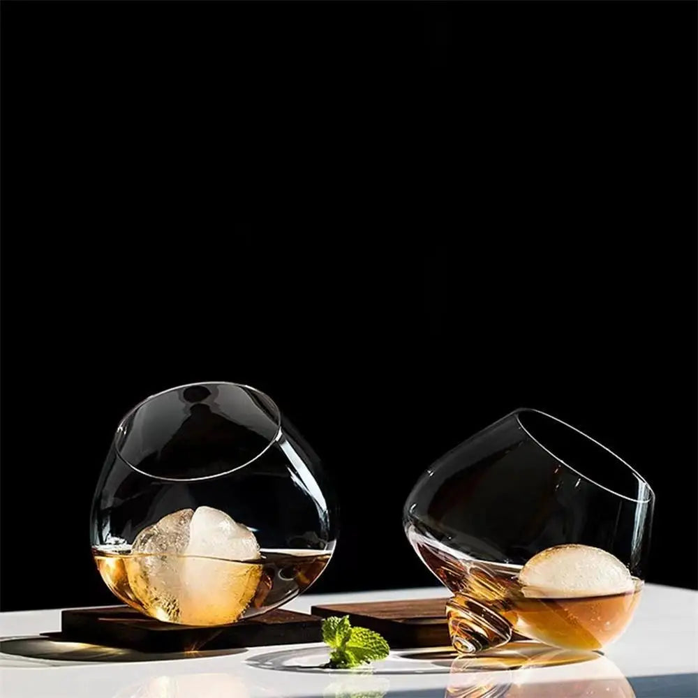 Dane whiskey glass rotating base enhances aromas and tasting experience for whiskey lovers