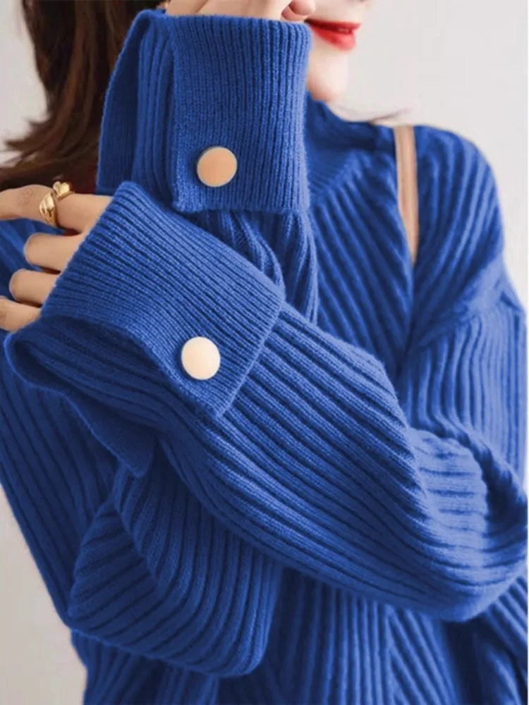 Women's oversized ribbed knit pullover in cozy draped silhouette with cuffed sleeves and button detail