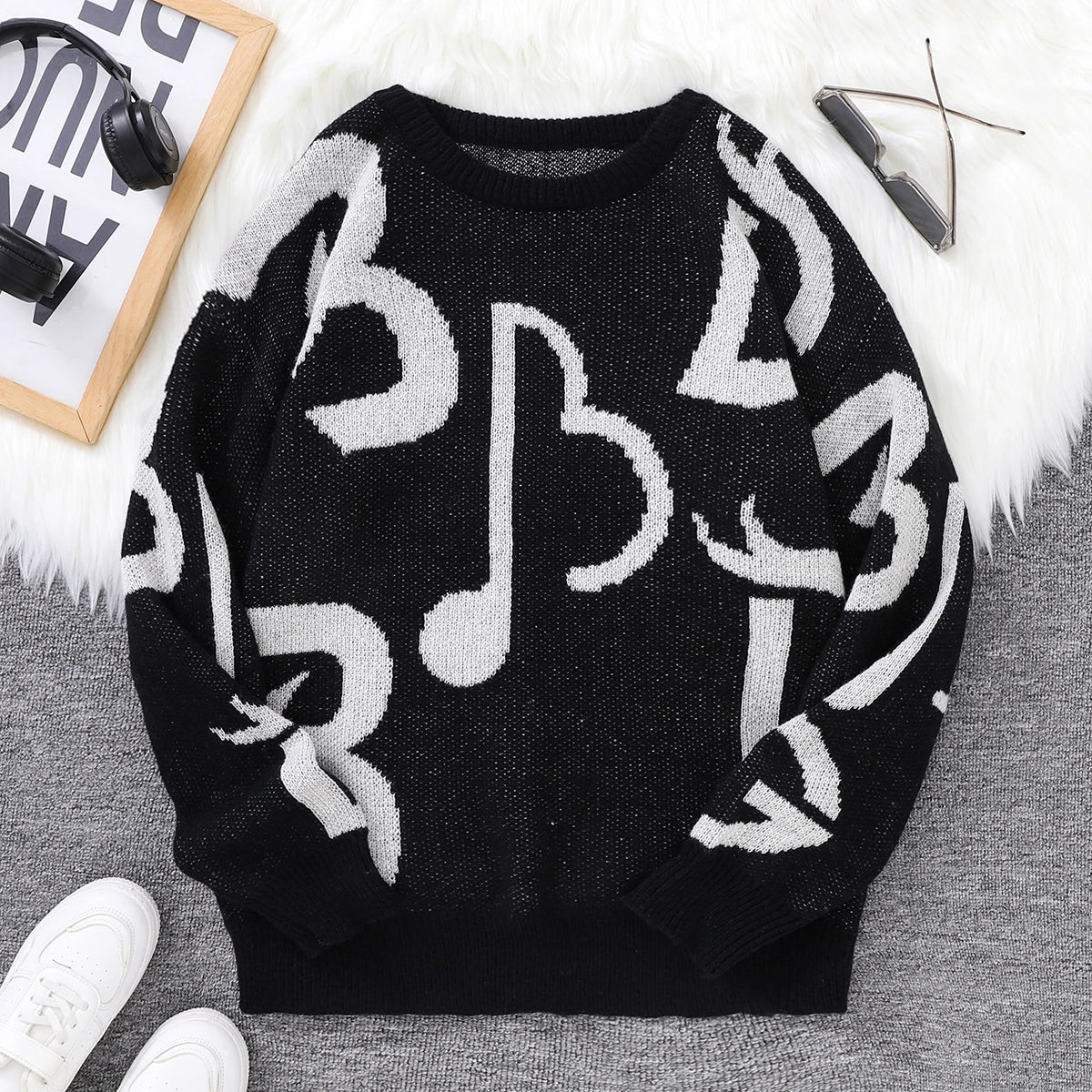 Black white music note pattern knit sweater oversized bold musical graphics cozy soft knit statement piece