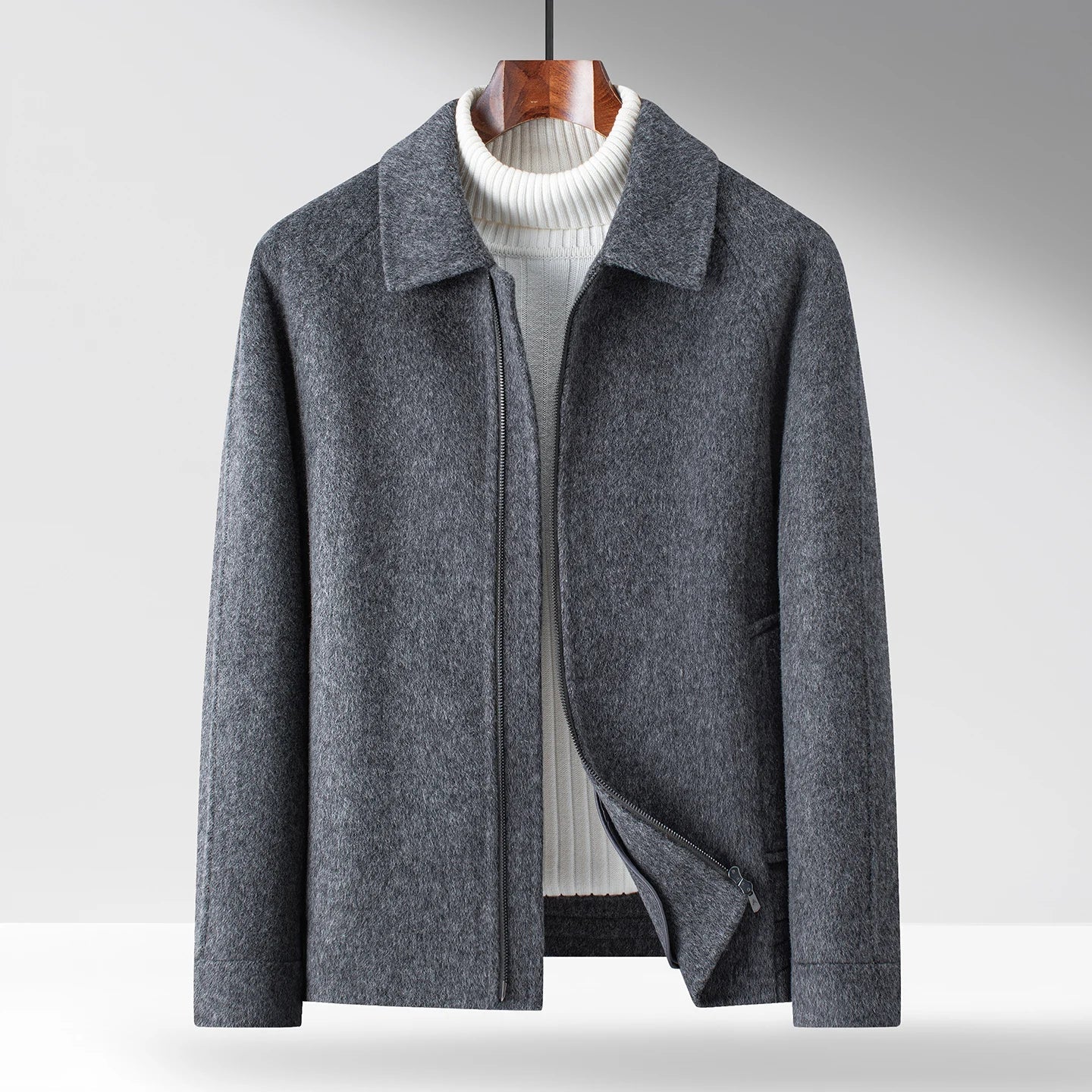 Black minimal zip-up winter jacket with polished collar and smooth interior for refined layering
