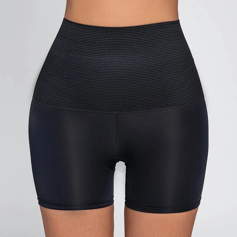 Black high-waist seamless shapewear shorts with ribbed compression band for all-day tummy control