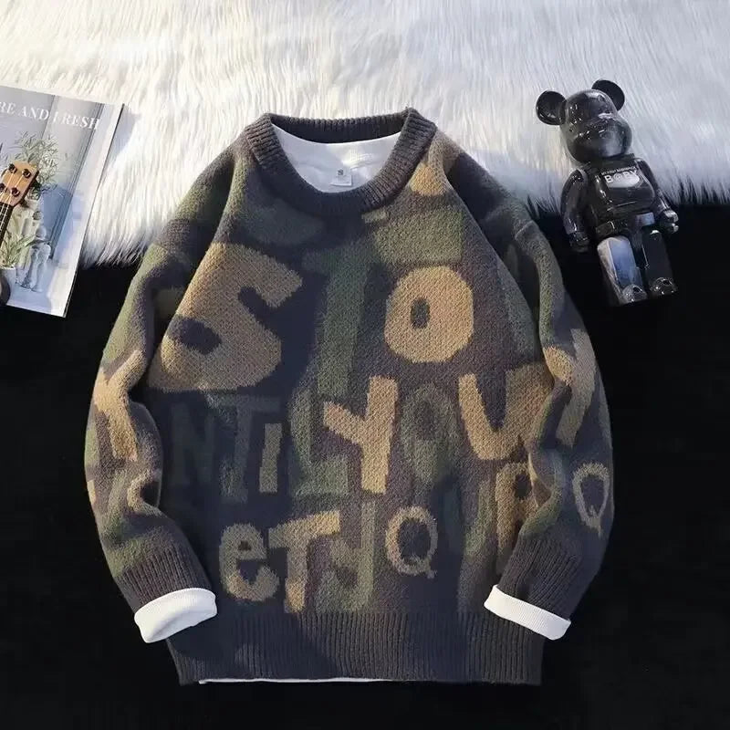 Oversized abstract letter pattern knit sweater in muted tones, cozy streetwear essential with bold typography