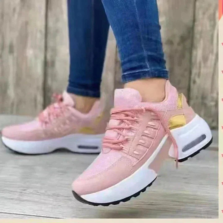White ergonomic orthopedic running shoes with shock-absorbing soles and stable supportive cushioned design