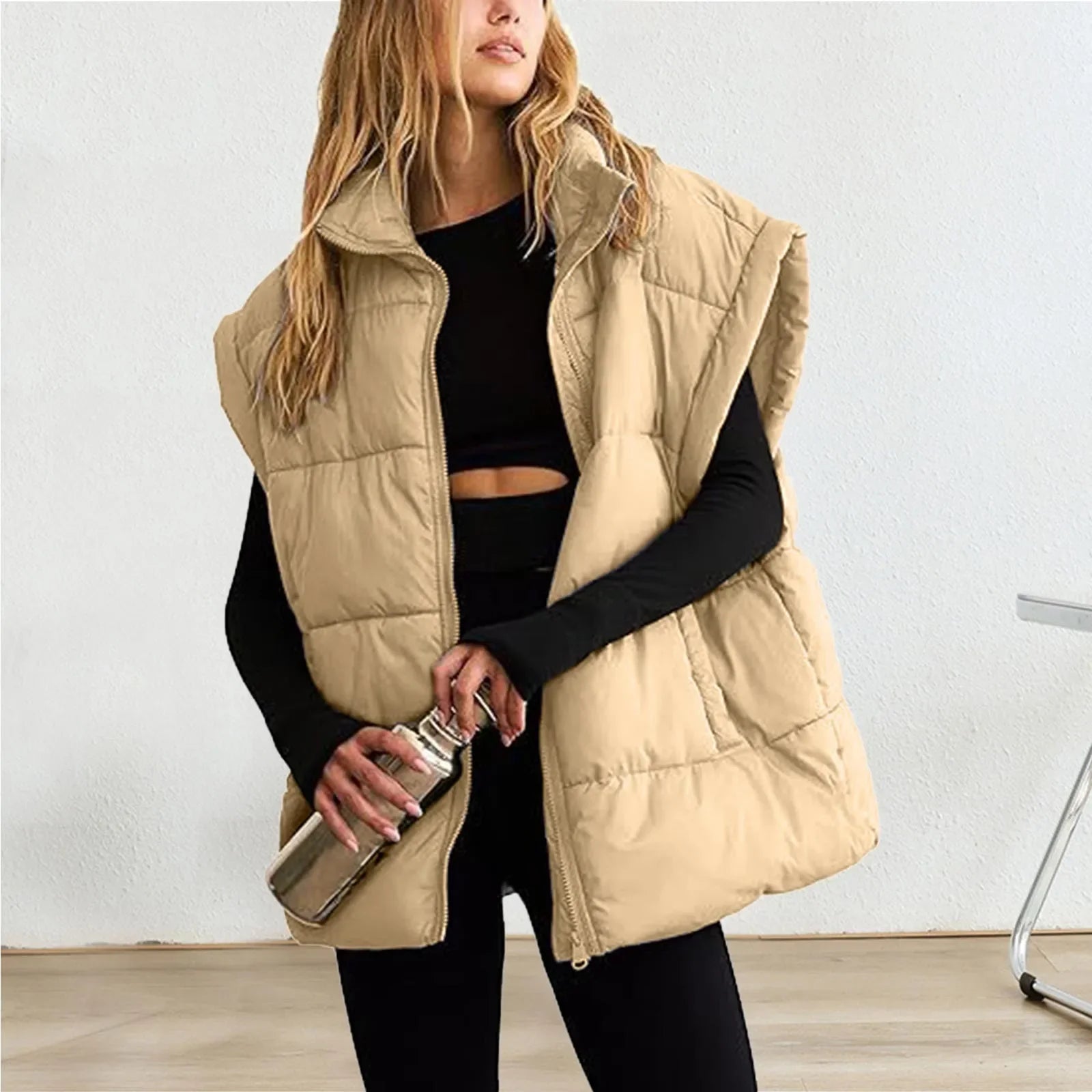 Black quilted down vest cold weather layering thick warm padding modern silhouette outdoor style