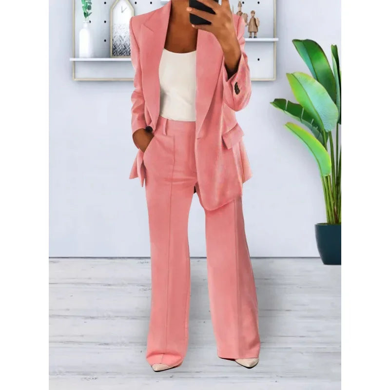Women's black tailored long blazer suit set with straight-leg trousers and refined lapel