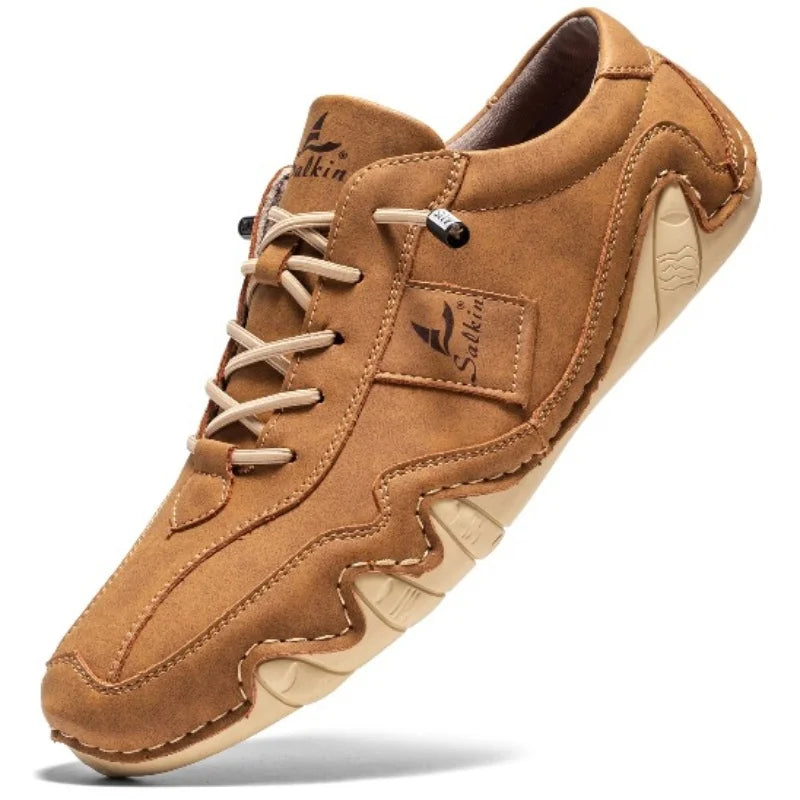 Men's deep burgundy faux leather low-top lace-up shoes with bold contrast stitching for urban style