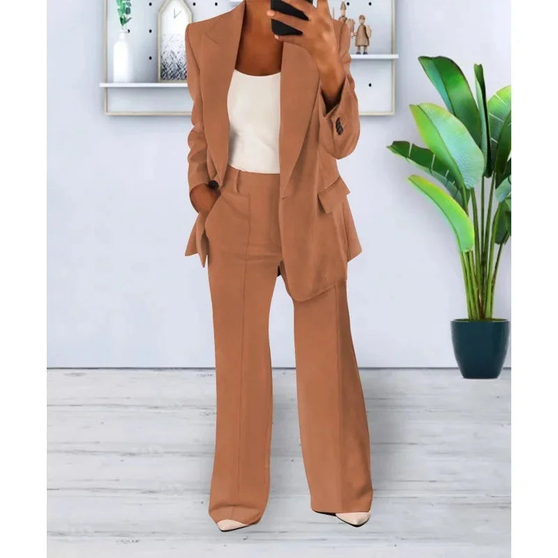 Women's black tailored long blazer suit set with straight-leg trousers and refined lapel