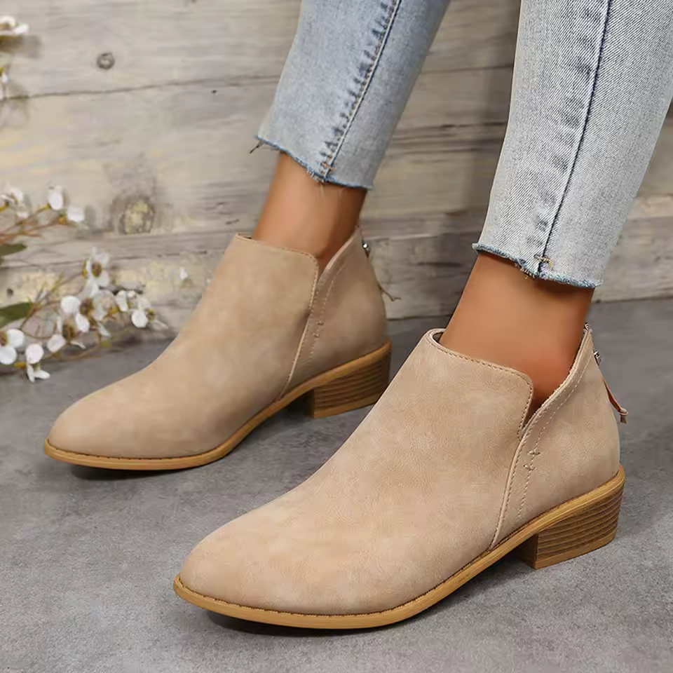 Women's black cushioned ankle boots with sleek silhouette and all-day comfort support for everyday wear