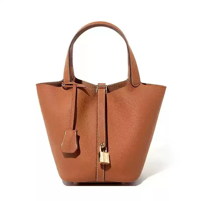 Structured grain leather tote bag for women, elegant everyday carry with secure strap closure