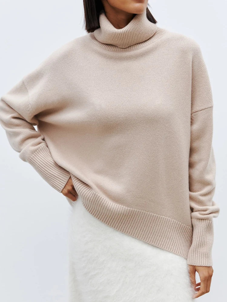 Women's oversized hip-length wool turtleneck sweater, relaxed silhouette in soft wool blend