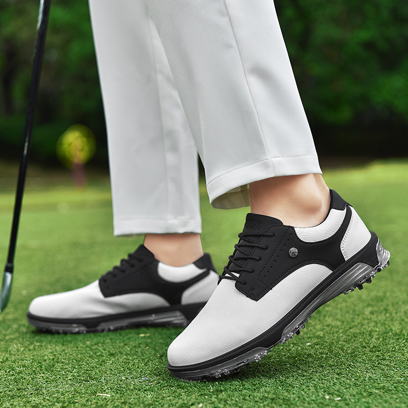 Men's white leather golf shoes with wide fit spiked cleats for stable traction and waterproof breathable design