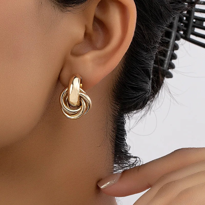 Atomica mini hoop earrings sleek minimalist silhouette polished non-tarnish finish everyday elegance