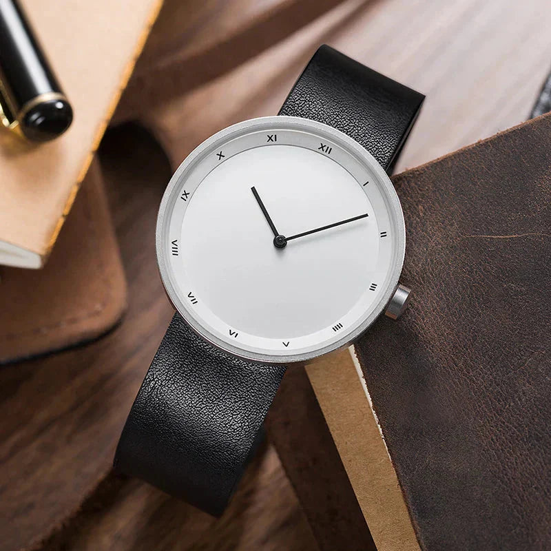 Men's minimalist leather wristwatch with Roman numeral markers, slim profile, timeless elegant design
