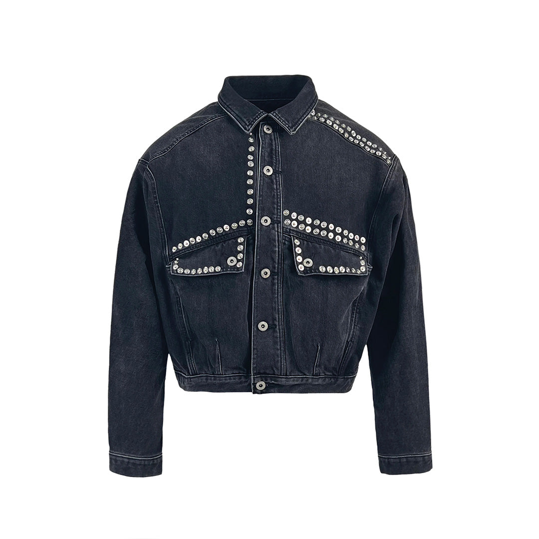 Dark wash heavyweight denim jacket structured silhouette with multi-rivet metal button detailing streetwear style