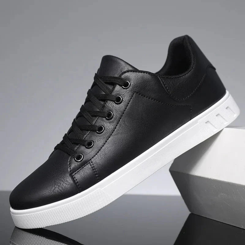 Men's white low top leather platform sneakers with lace-up design and padded collar for everyday wear