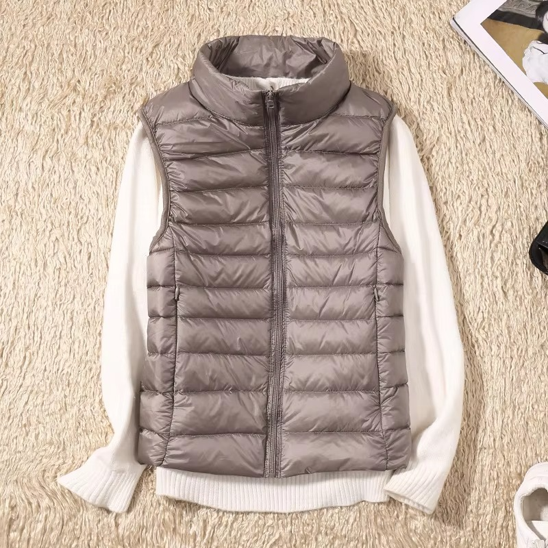 Women's cropped sleeveless down puffer vest lightweight nylon shell for layering and warmth