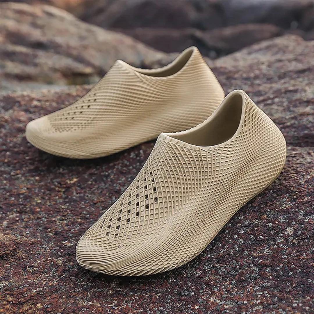 Lightweight slip-on EVA slippers in shell white with futuristic kinetic contours for active athletes
