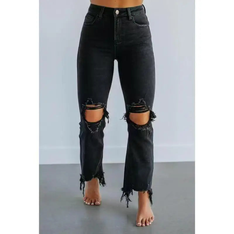 Women's high-rise ripped skinny jeans in stretch denim with distressed detailing and raw hem