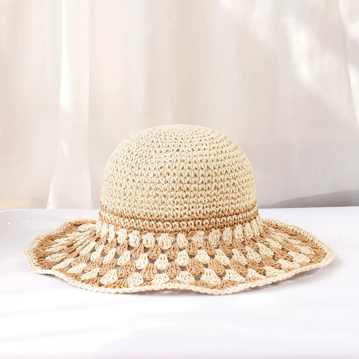 Women's boho wide-brim sun hat hand-crocheted with bold color block pattern for beach style