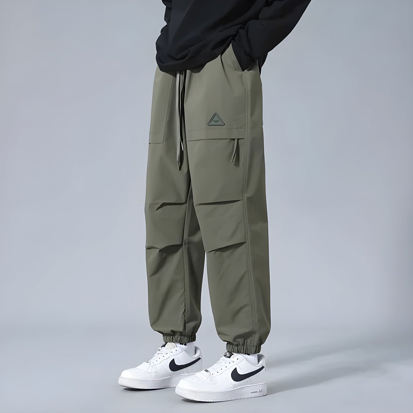 Men's relaxed fit cargo pants with elastic drawstring waist, utility style, multiple cargo pockets