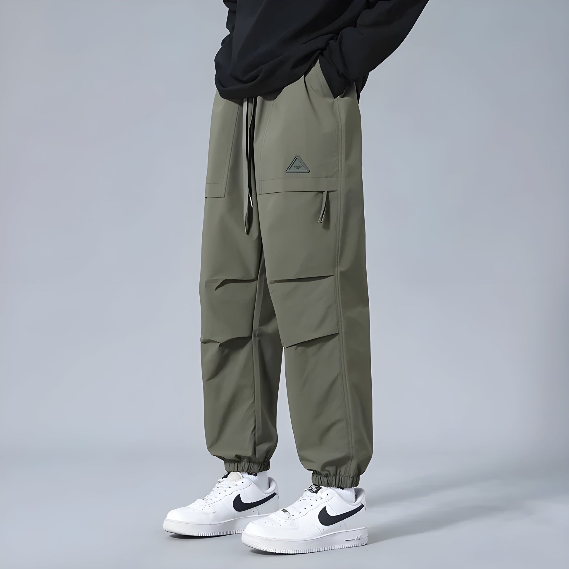 Men's relaxed fit cargo pants with elastic drawstring waist, utility style, multiple cargo pockets