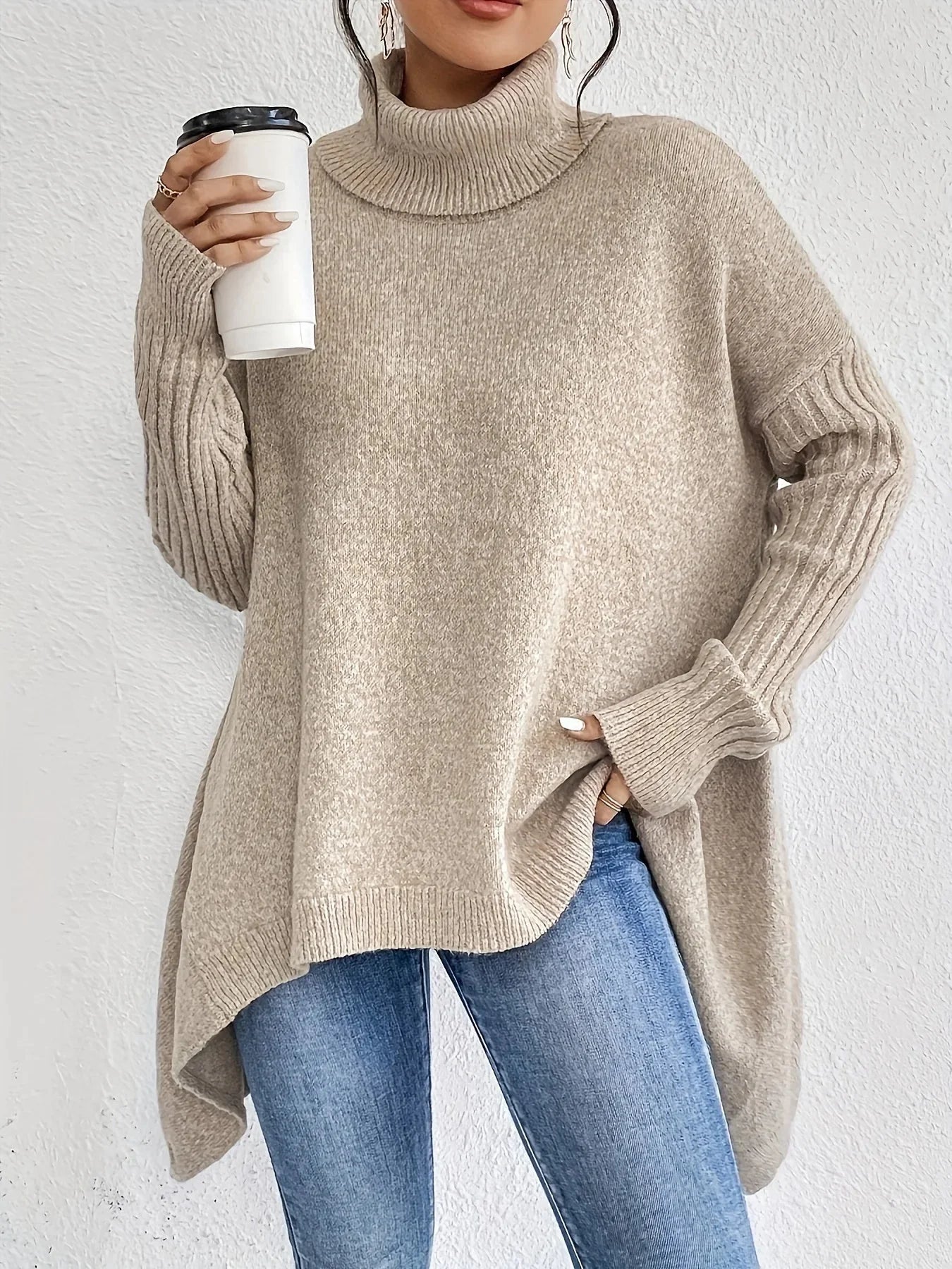 Women's relaxed fit turtleneck sweater with asymmetrical hem, cozy wool texture, chic everyday style
