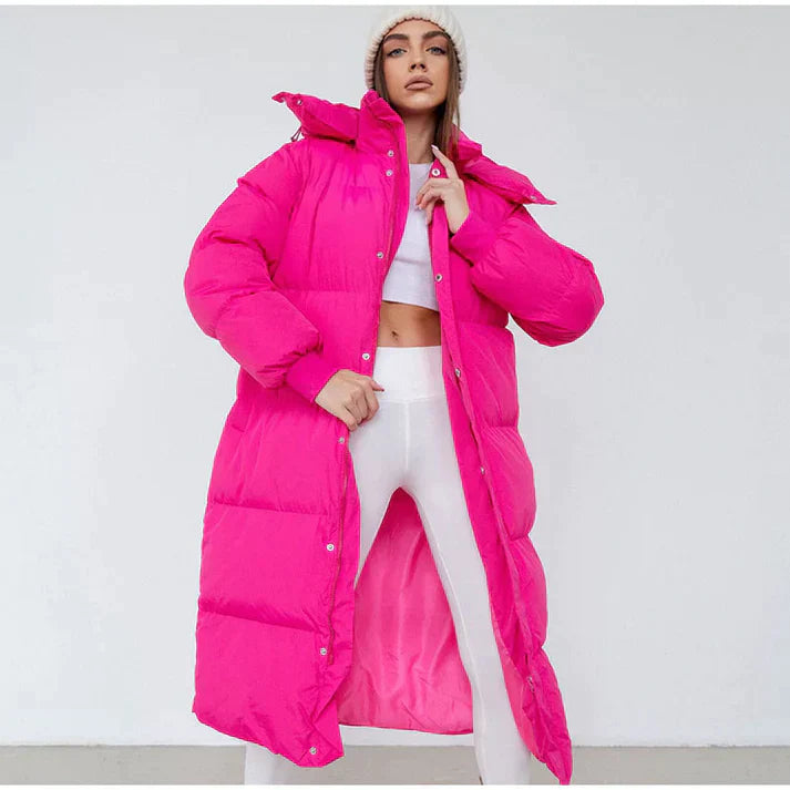 Women's long hooded puffer coat in neutral tone, full-length winter outerwear with streamlined silhouette