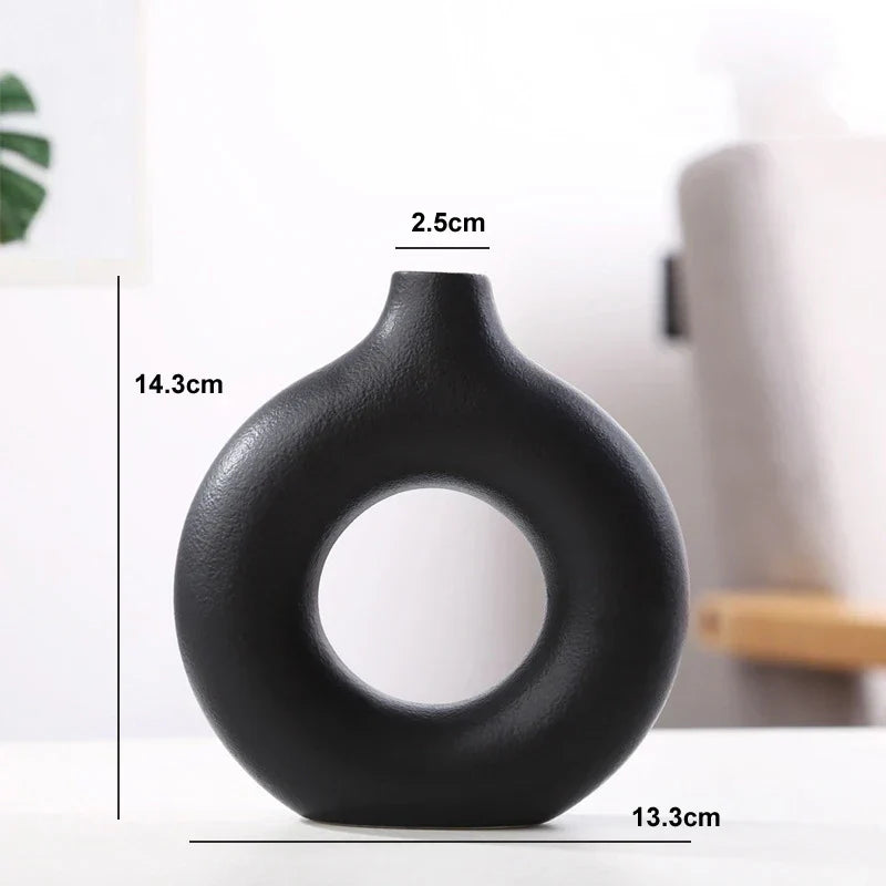 Stone-textured ceramic circular vase in natural calming tones, minimalist organic design for home decor