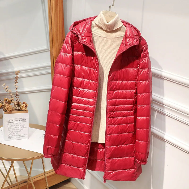 Women's long puffer jacket with hood, regular fit, elongated silhouette for cold-weather warmth