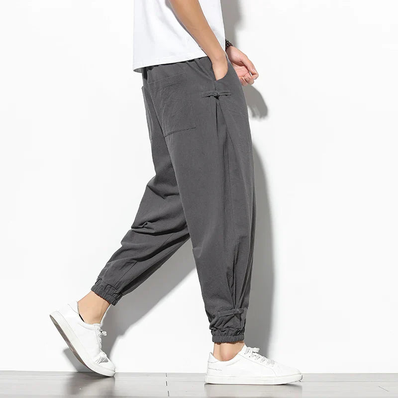 Toka relaxed tapered cotton-blend pants in neutral tone with adjustable drawstring waist