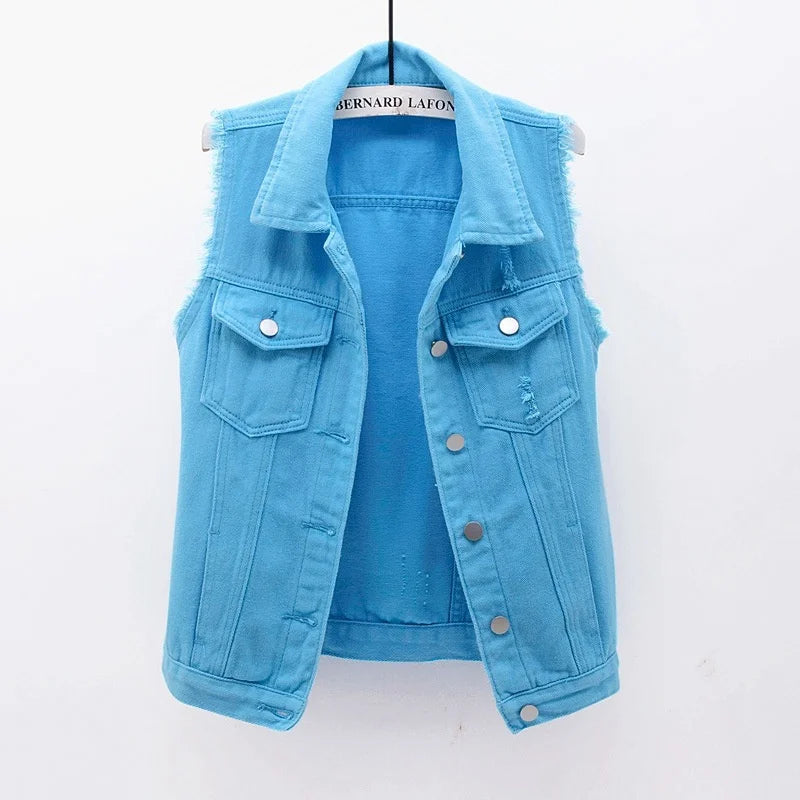 Oversized indigo denim vest with distressed edges, multi-pocket design, and heavyweight streetwear silhouette