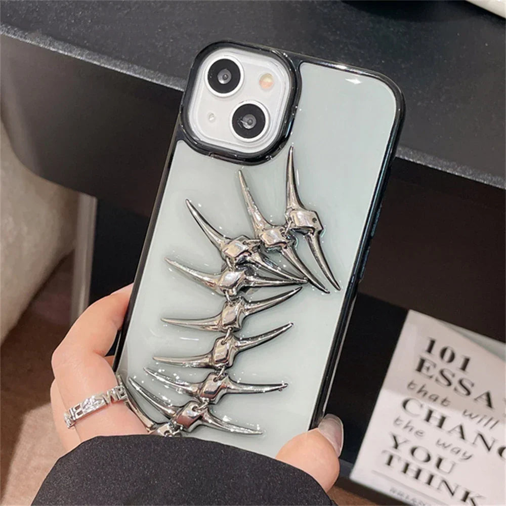 Chrome spine iPhone case with 3D fishbone design, rugged protection, and bold metallic camera guard