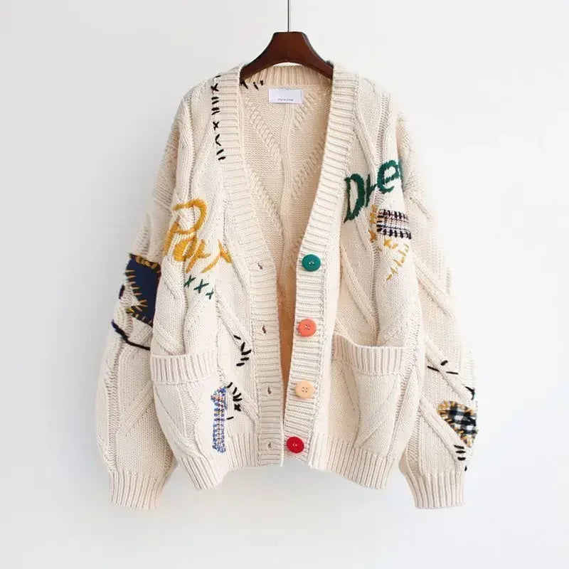 Relaxed-fit graphic knit cardigan with colorful buttons and hand-drawn embroidered details for creative style