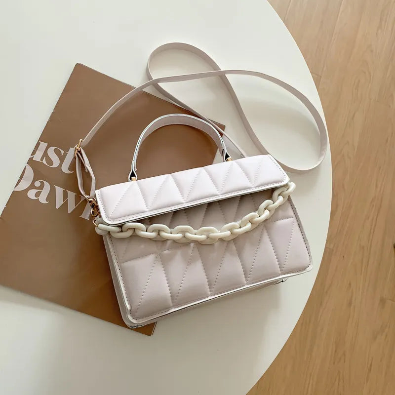 Nerys quilted handbag with bold gold chain handle, chic timeless design for everyday fashion