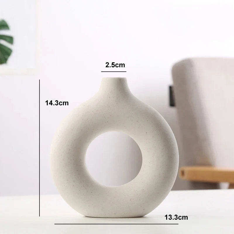 Stone-textured ceramic circular vase in natural calming tones, minimalist organic design for home decor